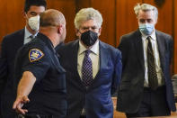 Glenn Horowitz, center, alongside Craig Inciardi, right, appear in criminal court after being indicted for conspiracy involving handwritten notes for the Eagles album "Hotel California," Tuesday, July 12, 2022, in New York. (AP Photo/John Minchillo)