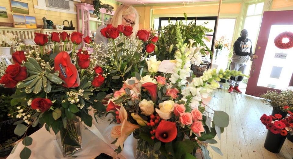 A floral designer fills one of 250 Valentine's Day orders in 2018 in Hyannis, Massechusetts.