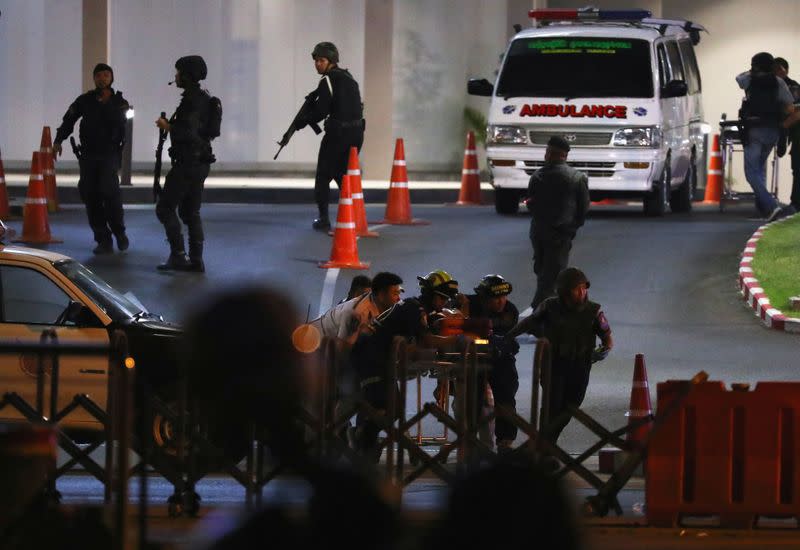 A member of Thai security forces is carried out after a raid inside the Terminal 21 shopping mall to try to stop a soldier on a rampage after a mass shooting, Nakhon Ratchasima, Thailand