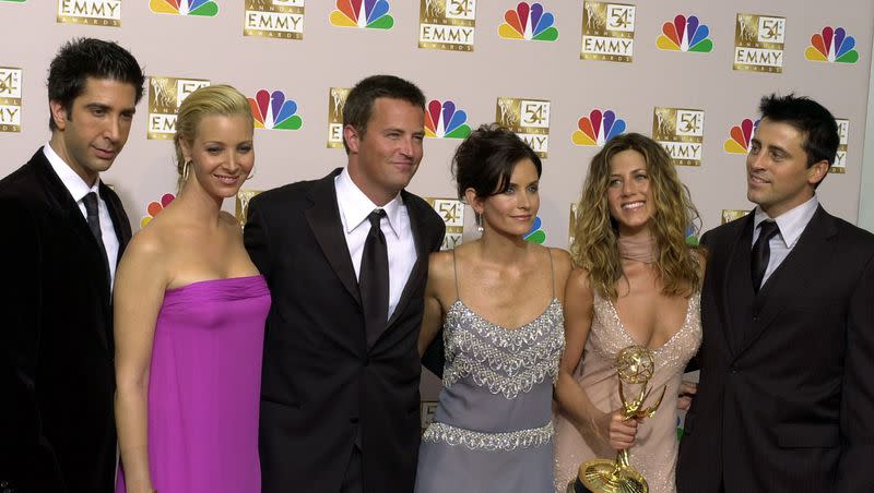The stars of “Friends,” from left, David Schwimmer, Lisa Kudrow, Matthew Perry, Courteney Cox Arquette, Jennifer Aniston and Matt LeBlanc pose after the 54th Annual Primetime Emmy Awards, at the Shrine Auditorium in Los Angeles in 2002. The group has released a statement concerning Perry’s death.