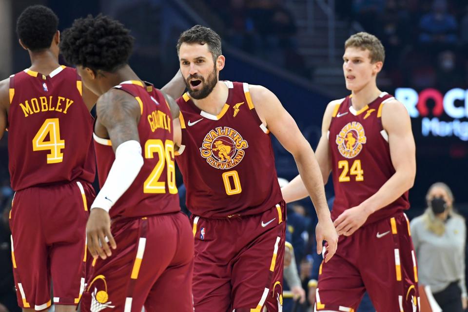 Cleveland forward Kevin Love (0) congratulates teammate Brandon Goodwin (26) during a game earlier this season. [Nick Cammett/Associated Press]