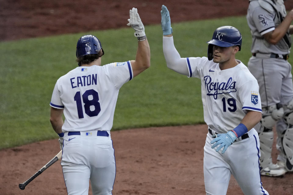 Kansas City Royals' Michael Massey (19) celebrates with Nate Eaton (18) after hitting a solo home run during the fourth inning of a baseball game against the Chicago White Sox Wednesday, May 10, 2023, in Kansas City, Mo. (AP Photo/Charlie Riedel)
