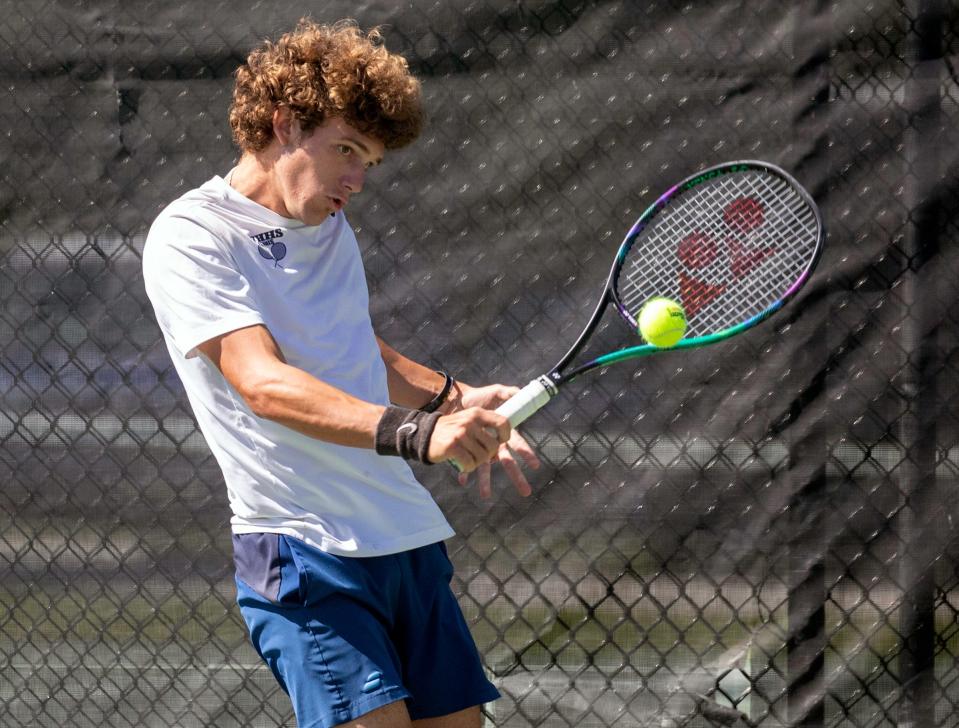 Winter Haven's Ben Saltman hits a backhand against Nico Kumria in his No. 1 singles final at the Polk County Boys Tennis Tournament at the Beerman Family Tennis Center.