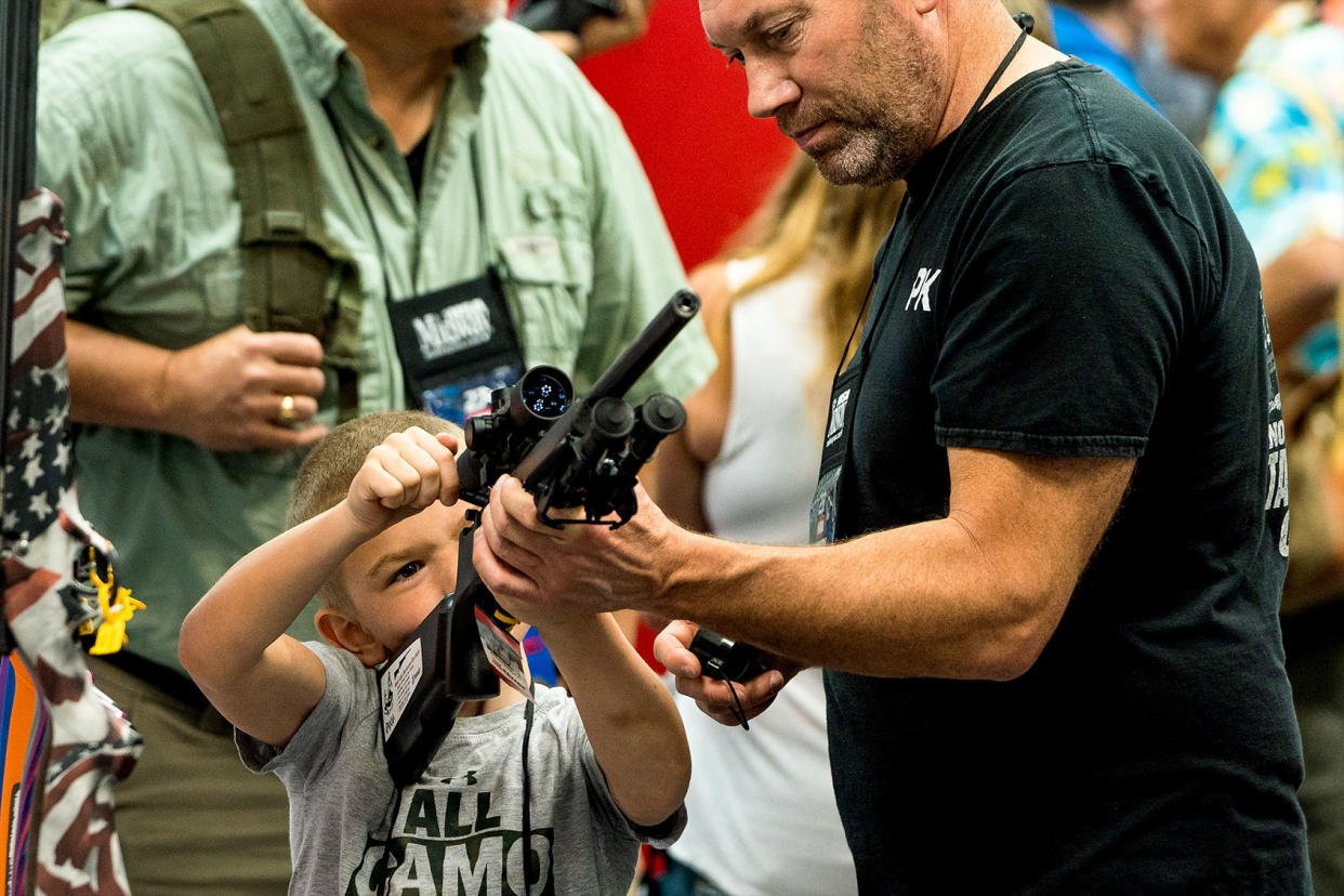 NRA Convention Child Loading A Gun Demetrius Freeman/The Washington Post via Getty Images