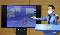 Yoon Seong-hyun, head of the Korea Coast Guard's investigation bureau, speaks during a briefing at the agency in Incheon, South Korea, Tuesday, Sept. 29, 2020. South Korea said Tuesday that a government official slain by North Korean sailors wanted to defect, concluding that the man, who had gambling debts, swam against unfavorable currents with the help of a life jacket and a floatation device and conveyed his intention of resettling in North Korea. (Yun Hyun-tae/Yonhap via AP)