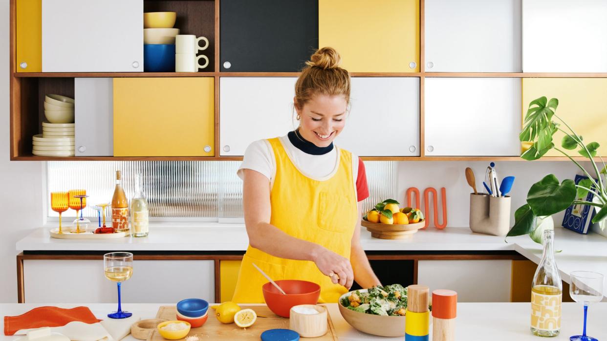  Molly Baz in colorful kitchen cooking 