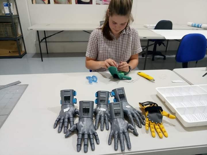 A volunteer working on the 3D hands at the Victorian warehouse. 