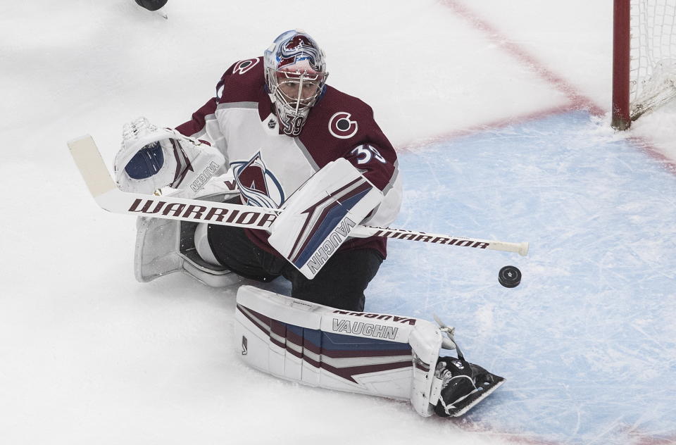 Colorado Avalanche goalie Pavel Francouz (39) makes the save against the Dallas Stars during first period NHL qualifying round game action in Edmonton, on Wednesday, Aug. 5, 2020. (Jason Franson/The Canadian Press via AP)