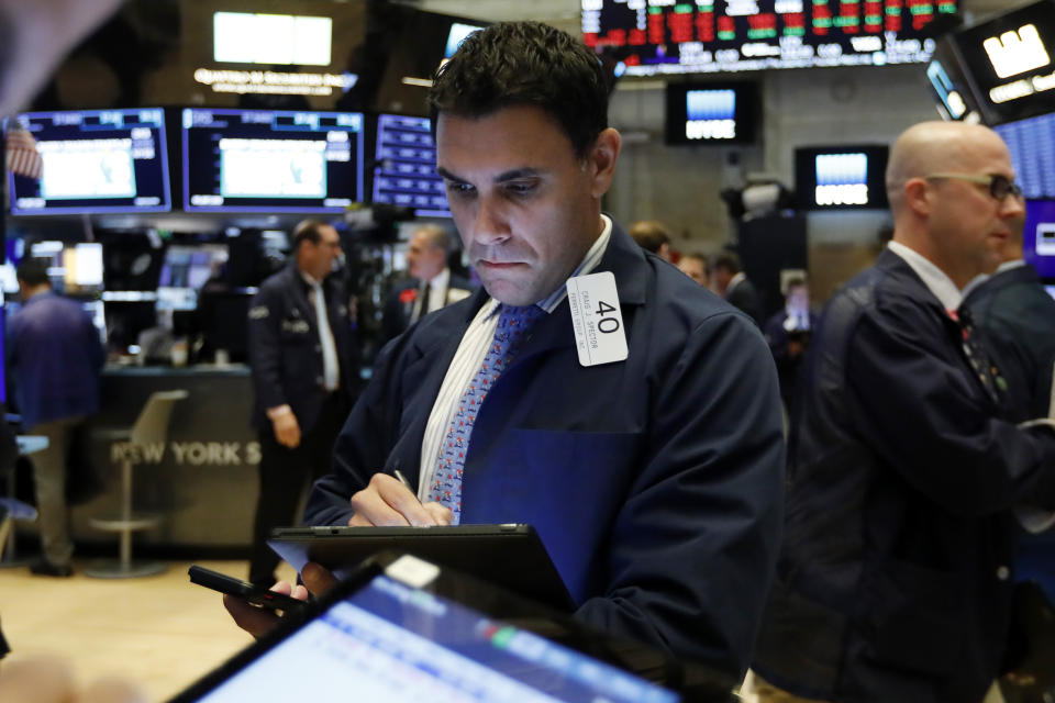 Trader Craig Spector works on the floor of the New York Stock Exchange, Tuesday, Oct. 8, 2019. Stocks are opening lower on Wall Street as tensions rose between Washington and Beijing just ahead of the latest round of trade talks. (AP Photo/Richard Drew)