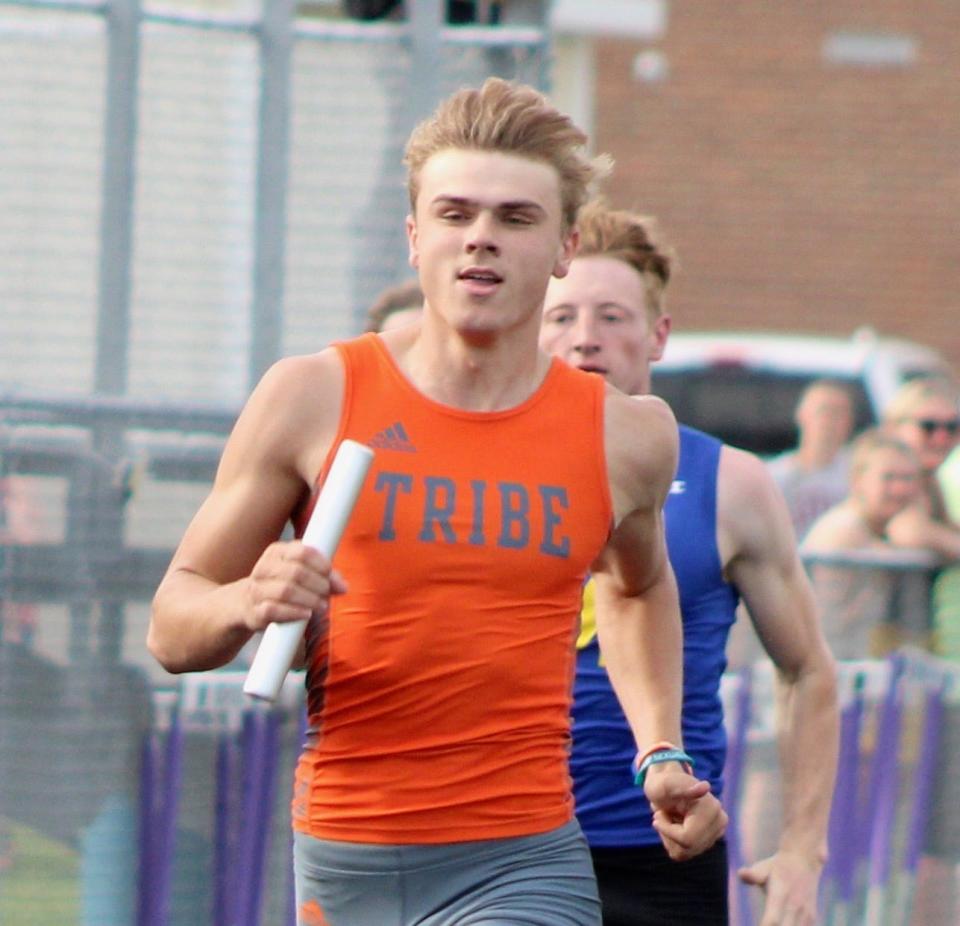 Tecumseh's Gavin Chenevey runs his leg of the 4x200 during the Lenawee County Track and Field Championships at Onsted.