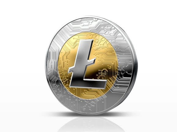 A silver and gold physical Litecoin.