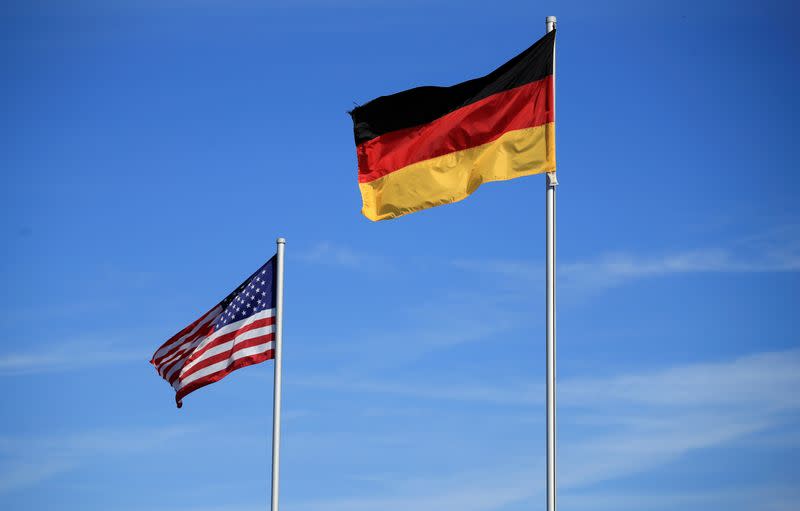 National flags of the U.S. and Germany flutter in the wind near the main gate of the U.S. Spangdahlem Air Base near Bitburg