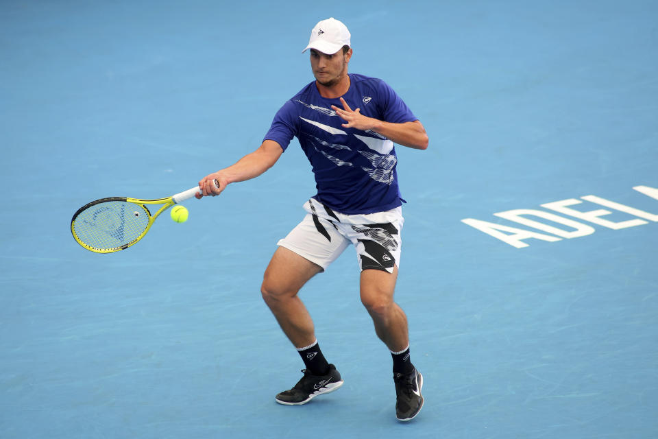 Serbia's Miomir Kecmanovic returns to Russia's Daniil Medvedev during their Round of 16 match at the Adelaide International Tennis tournament in Adelaide, Australia, Wednesday, Jan. 4, 2023. (AP Photo/Kelly Barnes)