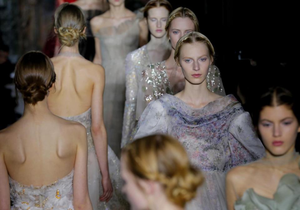 Models wear creations by fashion designers Maria Grazia Chiuri and Pier Paolo Piccioli for Valentino as part of the Women's Spring/Summer 2013 Haute Couture fashion collection presented in Paris, Wednesday, Jan. 23 2013 (AP Photo/ Jacques Brinon)