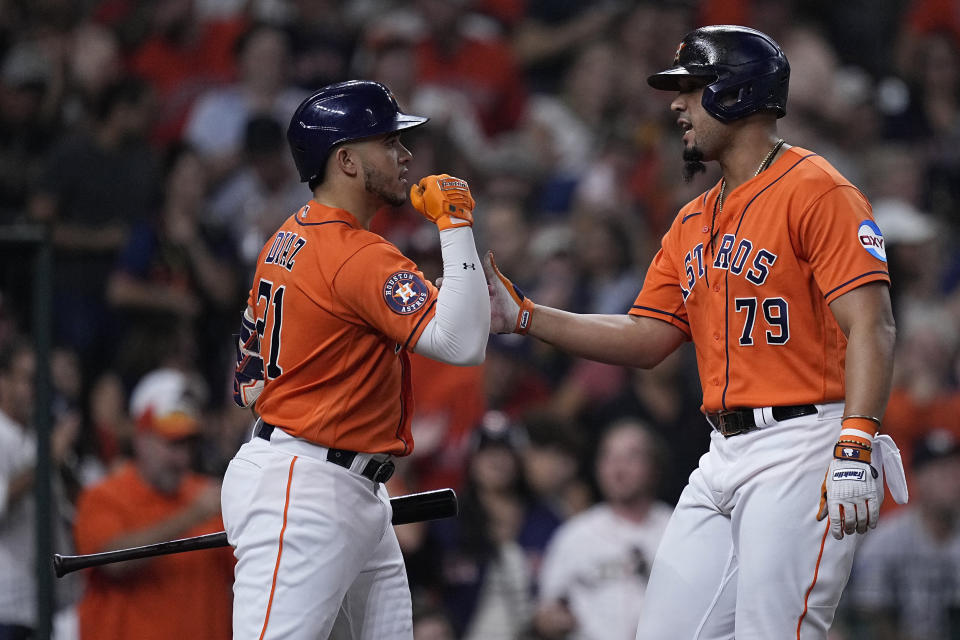 Houston Astros' Jose Abreu, right, celebrates with Yainer Diaz after hitting a solo home run against the New York Yankees during the second inning of a baseball game Friday, Sept. 1, 2023, in Houston. (AP Photo/Kevin M. Cox)