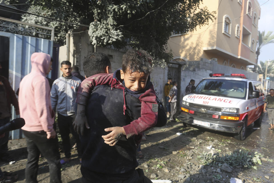 Palestinians evacuate wounded in Israeli bombardment Rafah, Gaza Strip, Friday, Dec. 1, 2023. (AP Photo/Hatem Ali)