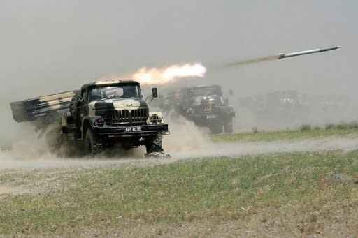 A rocket is fired during military exercises in Khujand, Tajikistan. Tajik militants who were engaged in deadly clashes with security forces earlier this week have refused to lay down their weapons despite a tense ceasefire, prosecutors said on Saturday