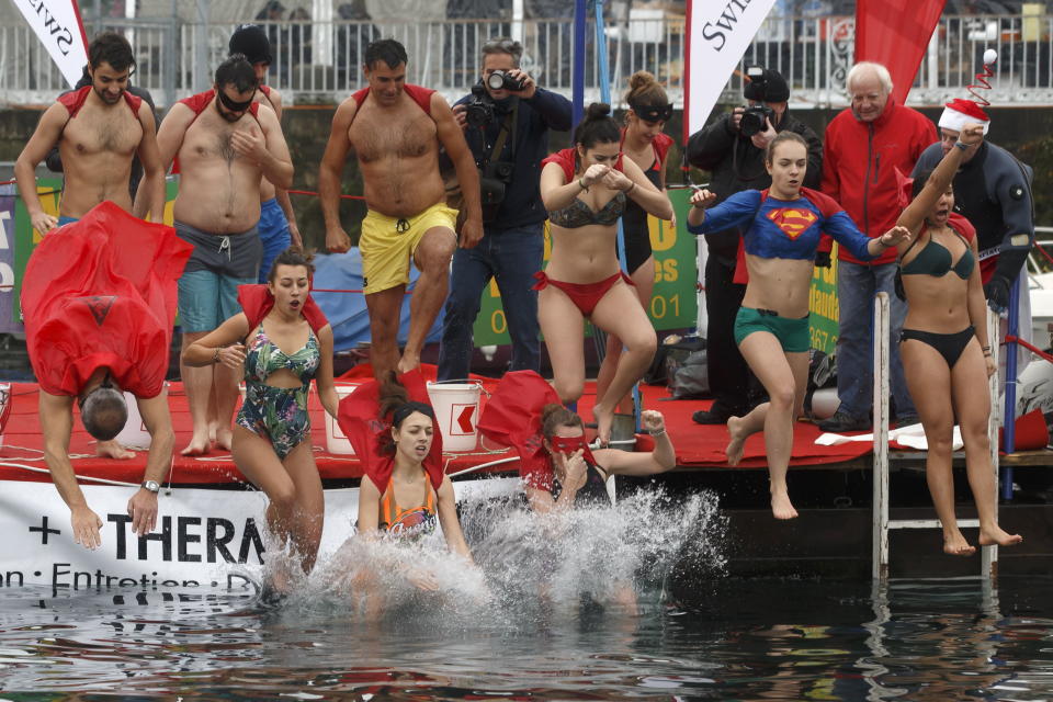 Participants of the 80th annual Christmas swimming ‘Coupe de Noel’ jump into the lake of Geneva