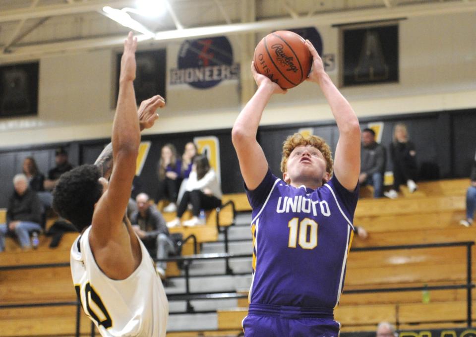 Unioto's David Long (#10, right) goes up for a shot during the Shermans' preseason scrimmage against the Paint Valley Bearcats at Paint Valley High School on Nov. 24, 2023, in Bainbridge, Ohio.