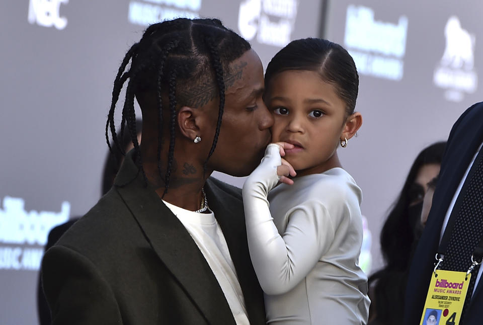 Travis Scott, left, and daughter Stormi Webster arrive at the Billboard Music Awards on Sunday, May 15, 2022, at the MGM Grand Garden Arena in Las Vegas. (Photo by Jordan Strauss/Invision/AP)