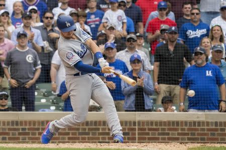 Jun 19, 2018; Chicago, IL, USA; Los Angeles Dodgers pinch hitter Kyle Farmer (17) hits a two run double during the ninth inning in game one of a baseball doubleheader against the Chicago Cubs at Wrigley Field. Mandatory Credit: Patrick Gorski-USA TODAY Sports