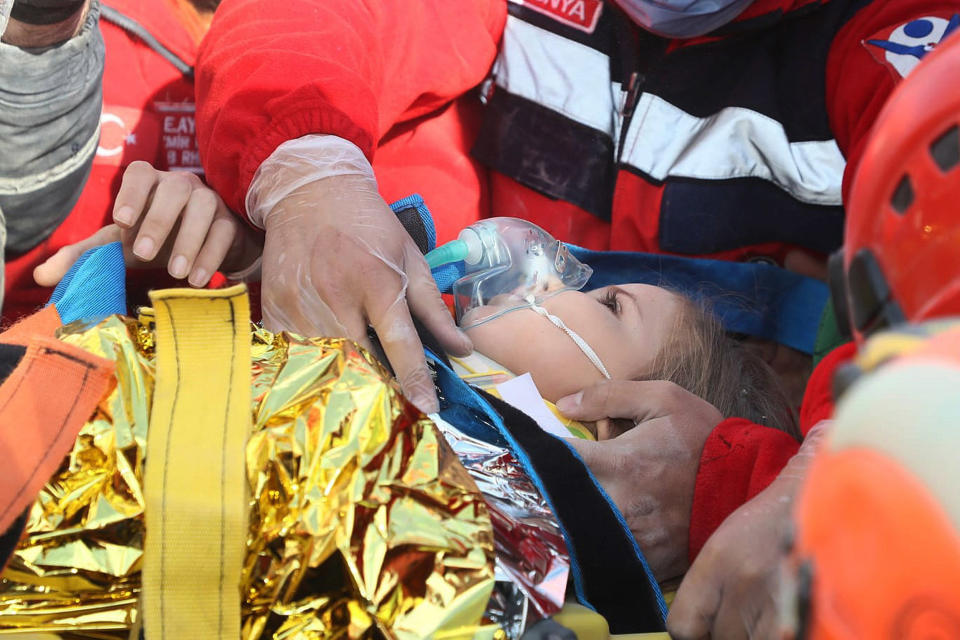 Image: Ayda Gezgin is rescued from the rubble in Izmir (AFAD / AP)