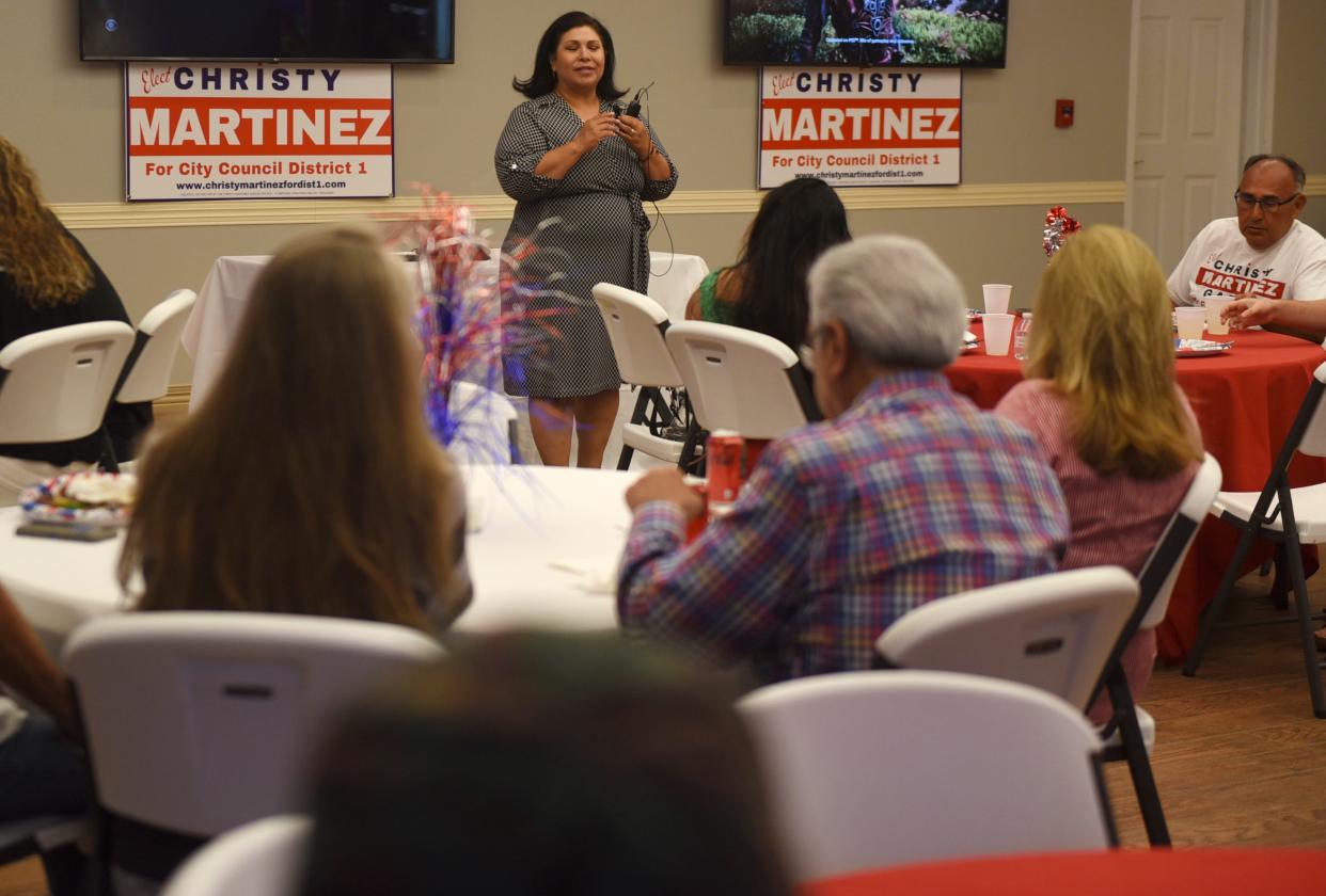 District 1 candidate Christy Martinez-Garcia speaks to supporter during her watch party, Saturday, May 7, 2022, in Lubbock. Martinez-Garcia is the founder of Los Hermanos Familia. 