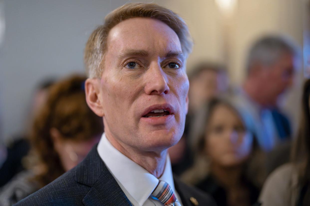Sen. James Lankford, R-Okla., the lead GOP negotiator on a border-foreign aid package, speaks with reporters outside the chamber at the Capitol in Washington, Thursday, Jan. 25, 2024.