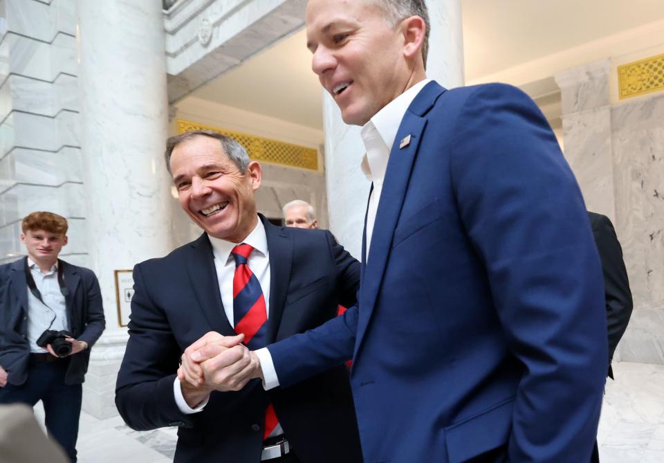 3rd Congressional District Rep. John R. Curtis, left, shakes hands with 1st District Rep. Blake Moore, R-Utah, after filing to run for the U.S. Senate at the Capitol in Salt Lake City, on Wednesday, Jan. 3, 2024. | Kristin Murphy, Deseret News