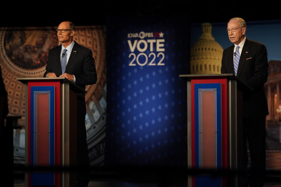 Iowa Democratic U.S. Senate candidate Mike Franken, left, and U.S. Sen. Chuck Grassley, R-Iowa, stand on stage before their debate, Thursday, Oct. 6, 2022, in Des Moines, Iowa. (AP Photo/Charlie Neibergall)