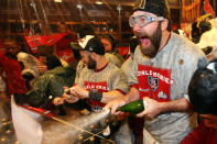 ST LOUIS, MO - OCTOBER 28: Jason Motte #30 and Skip Schumaker #55 of the St. Louis Cardinals celebrate in the locker room after defeating the Texas Rangers 6-2 to win Game Seven of the MLB World Series at Busch Stadium on October 28, 2011 in St Louis, Missouri. (Photo by Jamie Squire/Getty Images)