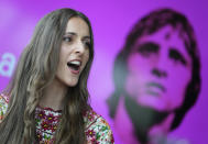 Myrthe Burger, who plays Johan Cruyff's wife Danny, sings during a presentation of "14 The Musical" in Leusden, Netherlands, Friday, June 11, 2021. On the opening day of the pandemic-delayed European 2020 Soccer Championship, the cast and crew of "14 The Musical", referring to Cruyff's shirt number, raised the curtain on the new musical eulogizing the country's most famous footballing son, Johan Cruyff. (AP Photo/Peter Dejong)