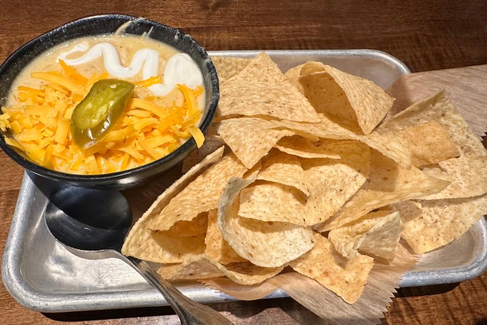 A cup of white chicken chili at Table Six Kitchen + Bar.