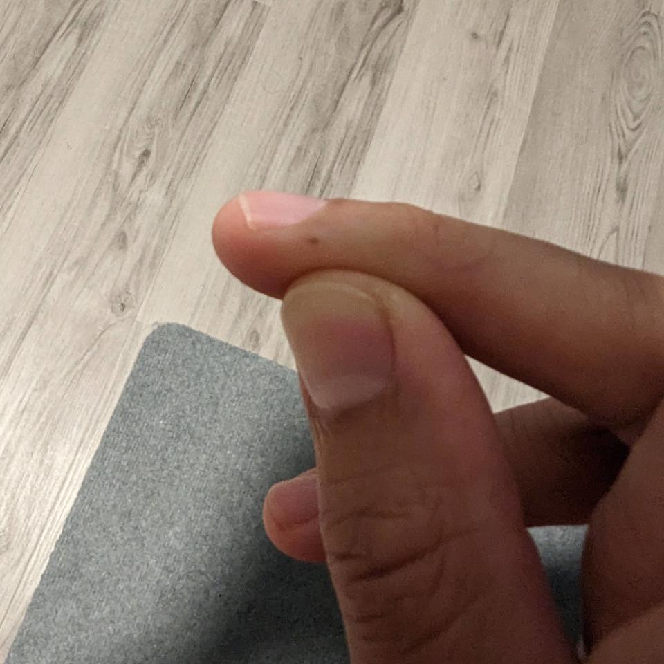 A dot on someone's finger