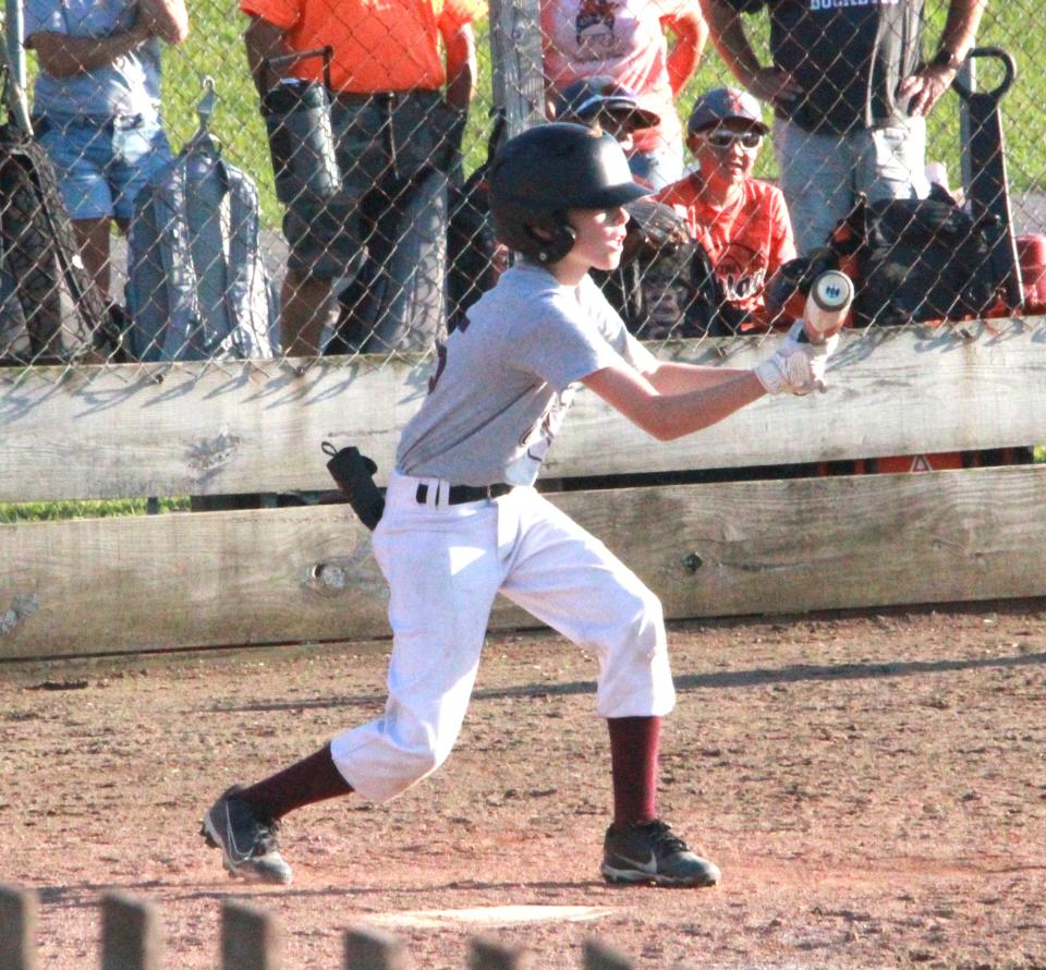 Union City's Logan Miller shows bunt Wednesday night versus Quincy at the Branch County Fair
