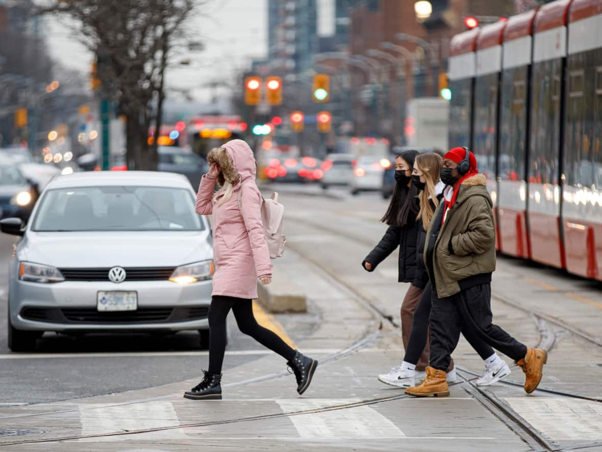 Public health experts in Ontario have previously said they expect new COVID-19 cases to continue rising in the province into the new year, in part because colder weather is keeping more people indoors. (Evan Mitsui/CBC - image credit)