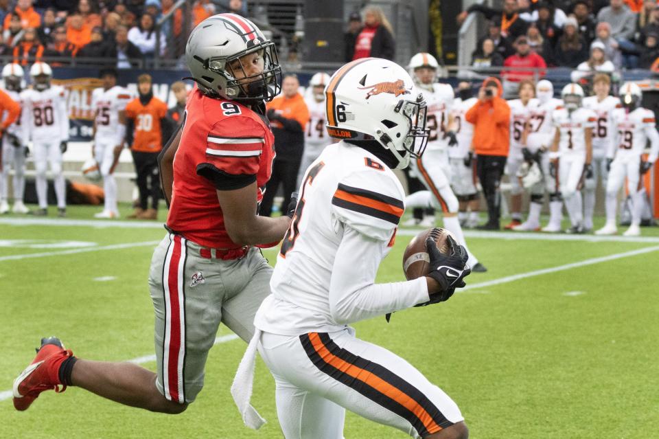 Massillon’s Adonis Marshall intercepts a pass intended for McKinley’s Dante McClellan on Saturday, Oct. 21, 2023.