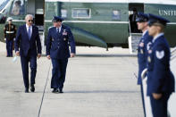 President Joe Biden speaks with Colonel William (Chris) McDonald, Vice Commander, 89th Air Wing before boarding Air Force One for a trip to New York to attend the United Nations General Assembly, Monday, Sept. 20, 2021, at Andrews Air Force Base, Md. (AP Photo/Evan Vucci)