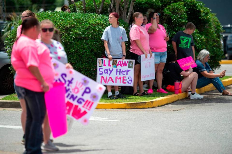 Protestors in support of Heather Wyatt and Aubreigh Wyatt wait outside the Jackson County Courts building on Thursday, July 18, 2024, as Heather Wyatt participates in a chancery court hearing inside the courthouse.
