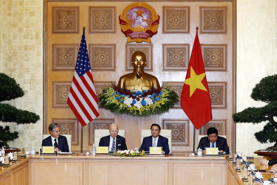 U.S. President Joe Biden, center left, and Vietnamese Prime Minister Pham Minh Chinh, center right, attend a business roundtable meeting at the Government Office in Hanoi, Vietnam, Monday, Sept. 11, 2023. (AP Photo/Minh Hoang, Pool)