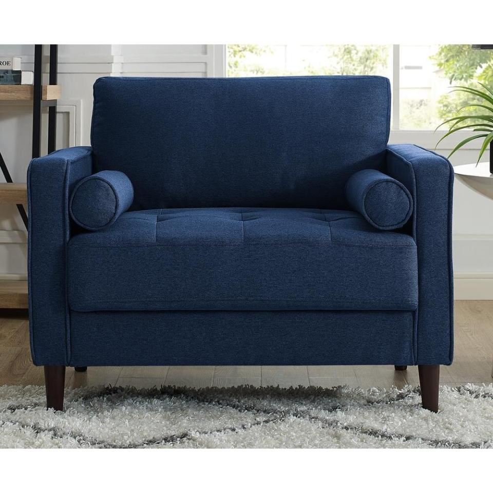 This chair features clean lines that can work for just about any style you're going for. And yes, the pillows are a part of of package. <a href="https://fave.co/3lyLNIH" target="_blank" rel="noopener noreferrer">Originally $194, get it now for $170 at The Home Depot</a>.