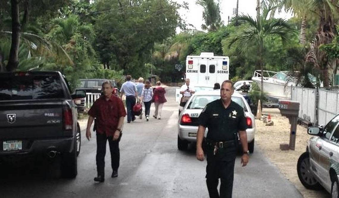 Police work a murder scene at a Tavernier home in the Florida Keys where Tara Rosado and Carlos Ortiz were found shot to death Oct. 16, 2015.