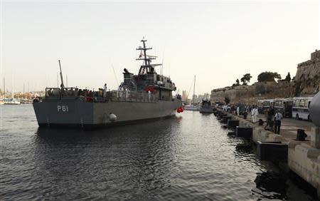 An Armed Forces of Malta (AFM) ship carrying rescued migrants arrives at the AFM Maritime Squadron base at Haywharf in Valletta's Marsamxett Harbour October 12, 2013. REUTERS/Darrin Zammit Lupi