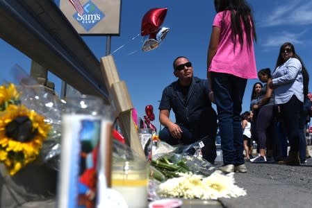 People pay their respects two days after a mass shooting in El Paso