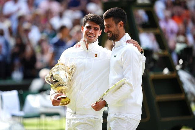 Carlos Alcaraz, left, stood with Novak Djokovic