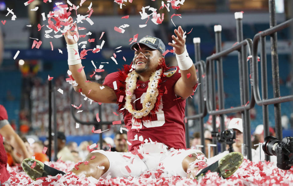 Alabama quarterback Tua Tagovailoa throws confetti in the air after winning the Orange Bowl against Oklahoma in Miami Gardens, Fla. Alabama defeated Oklahoma 45-34. (AP)