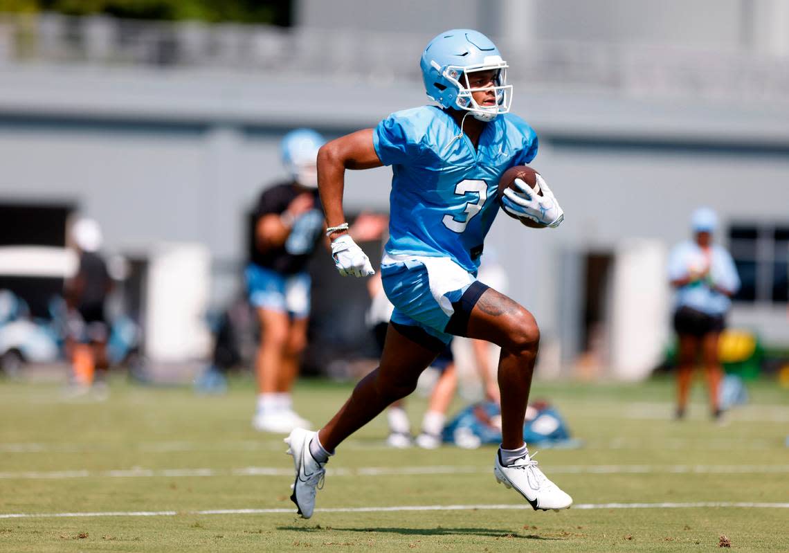 North Carolina wide receiver Antoine Green runs the ball during UNC’s first football practice of the season on Friday, July 29, 2022, in Chapel Hill, N.C.
