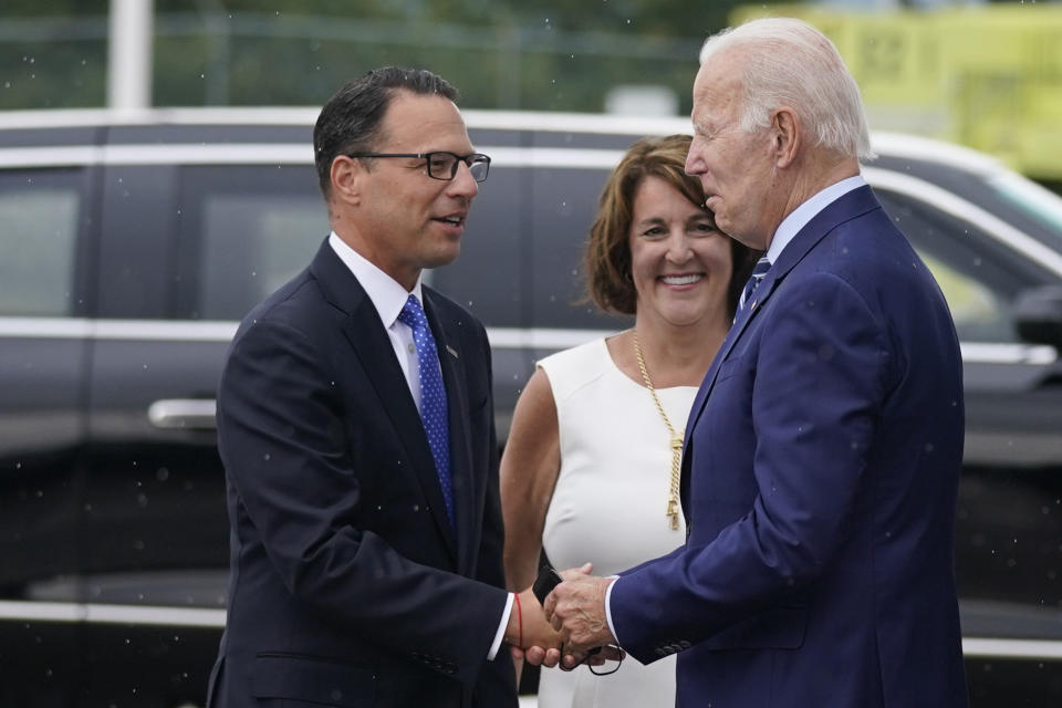 FILE - President Joe Biden greets Pennsylvania candidate for governor, state Attorney General Josh Shapiro, left, and Terese Casey, wife of Sen. Bob Casey, D-Pa., as he arrives at Wilkes-Barre Scranton International airport, Aug. 30, 2022, in Avoca, Pa. In Pennsylvania, Democratic candidate for governor, Shapiro, argues that his focus on public safety, education, the economy and freedom is driving his momentum, he concedes that the quality of his opponent is also a major factor. (AP Photo/Evan Vucci, File)