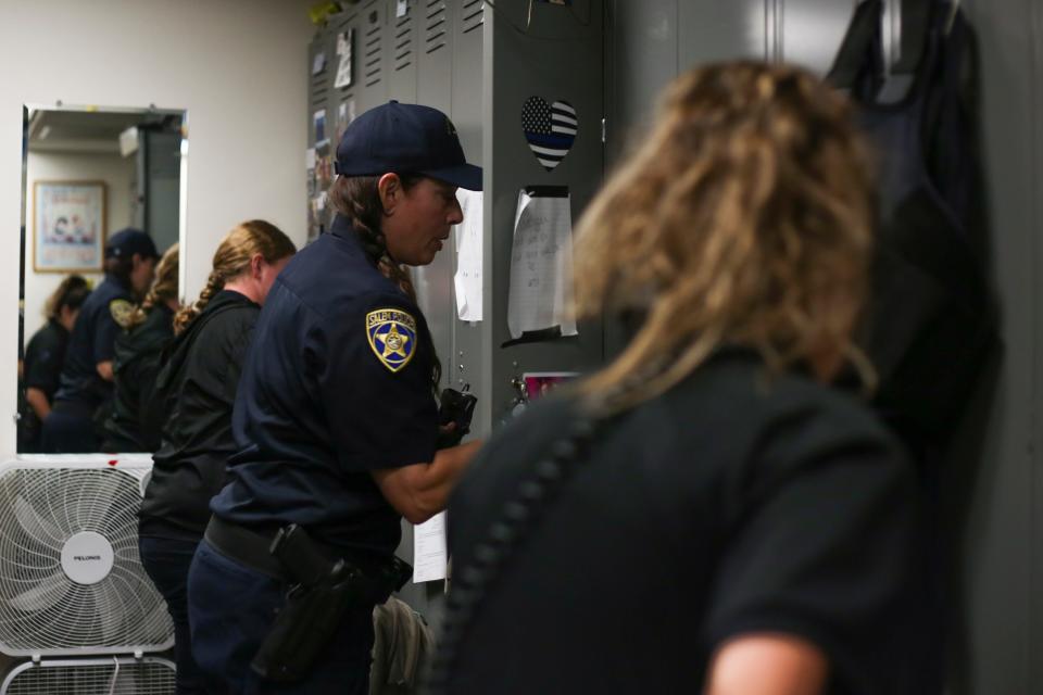 Officer Michelle Pratt gets ready for her day-shift patrol at the Salem Police Department on May 6, 2020.