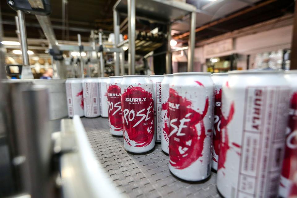 <p>This rosé-inspired lager from <a href="https://surlybrewing.com/beer/rose/" rel="nofollow noopener" target="_blank" data-ylk="slk:Surly Brewing Co.;elm:context_link;itc:0;sec:content-canvas" class="link ">Surly Brewing Co.</a> in Minnesota is available through the summer and features a refreshing blend of Warrior hops and fruity taste. The pour is light pink and sure to make both beer and wine drinkers happy. </p>